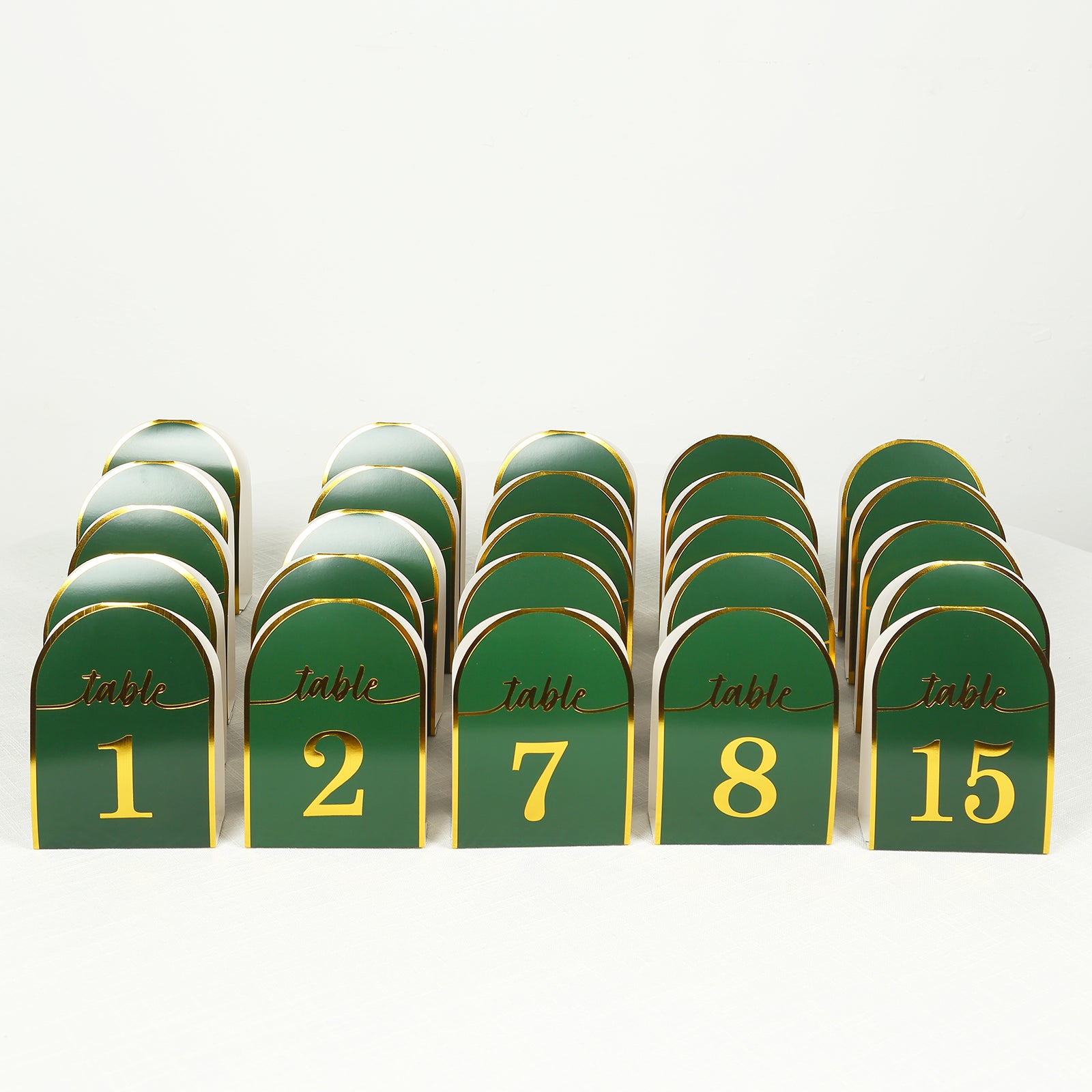 Hunter emerald green table numbers with metallic gold foil, numbers 1-25.