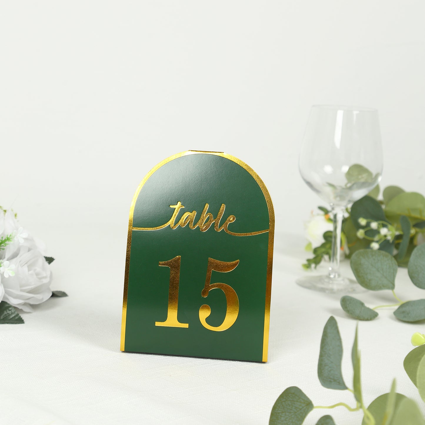 Hunter emerald green table number 15 with metallic gold foil.