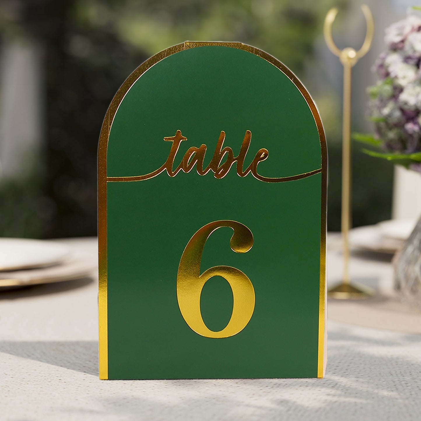 Hunter emerald green table number with metallic gold foil.