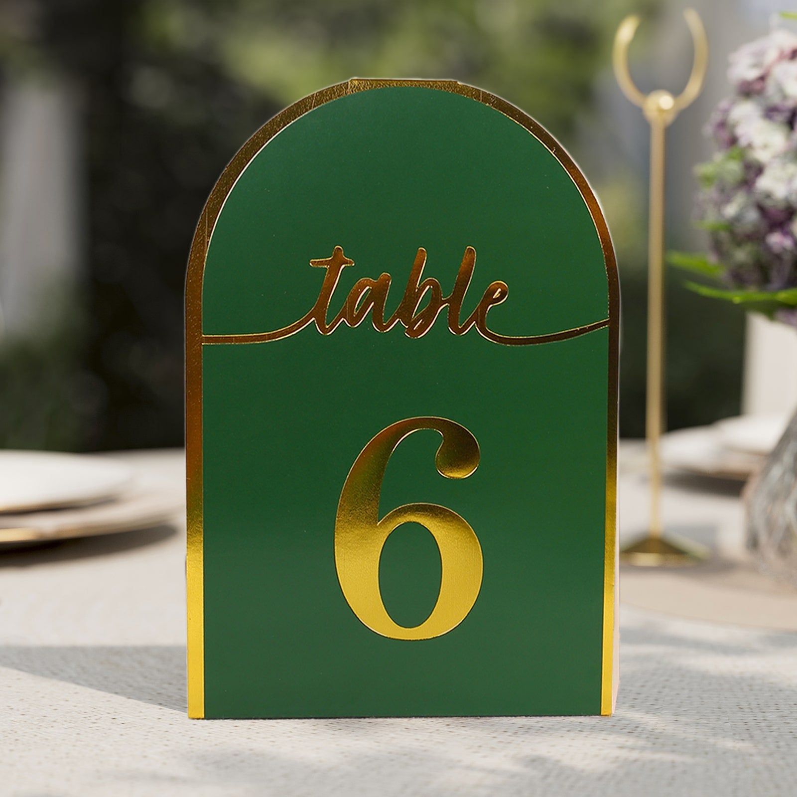 Hunter emerald green table number with metallic gold foil.