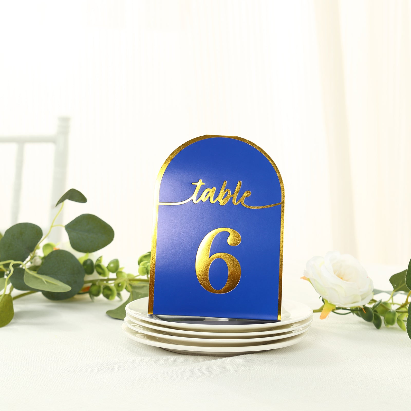 Royal blue table number card with gold foil, displaying the number 6.