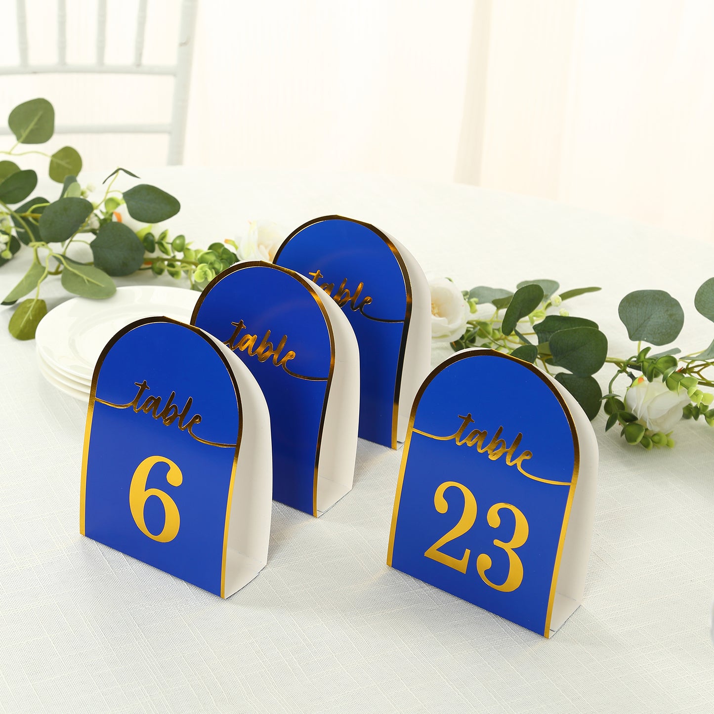 Royal blue table numbers with metallic gold foil numbers 1-25.