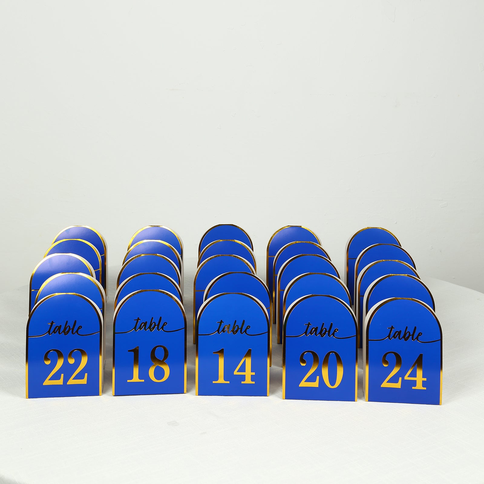 Royal blue disposable table numbers with metallic gold foil, numbers 1-25.