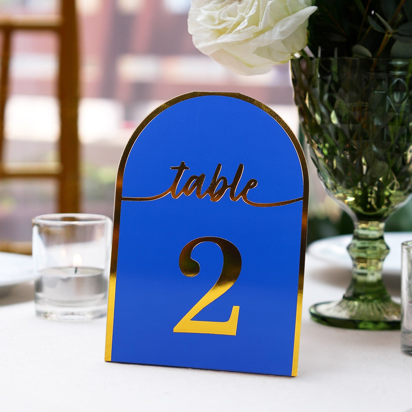 Royal blue disposable table number card with metallic gold foil, showing number 2.