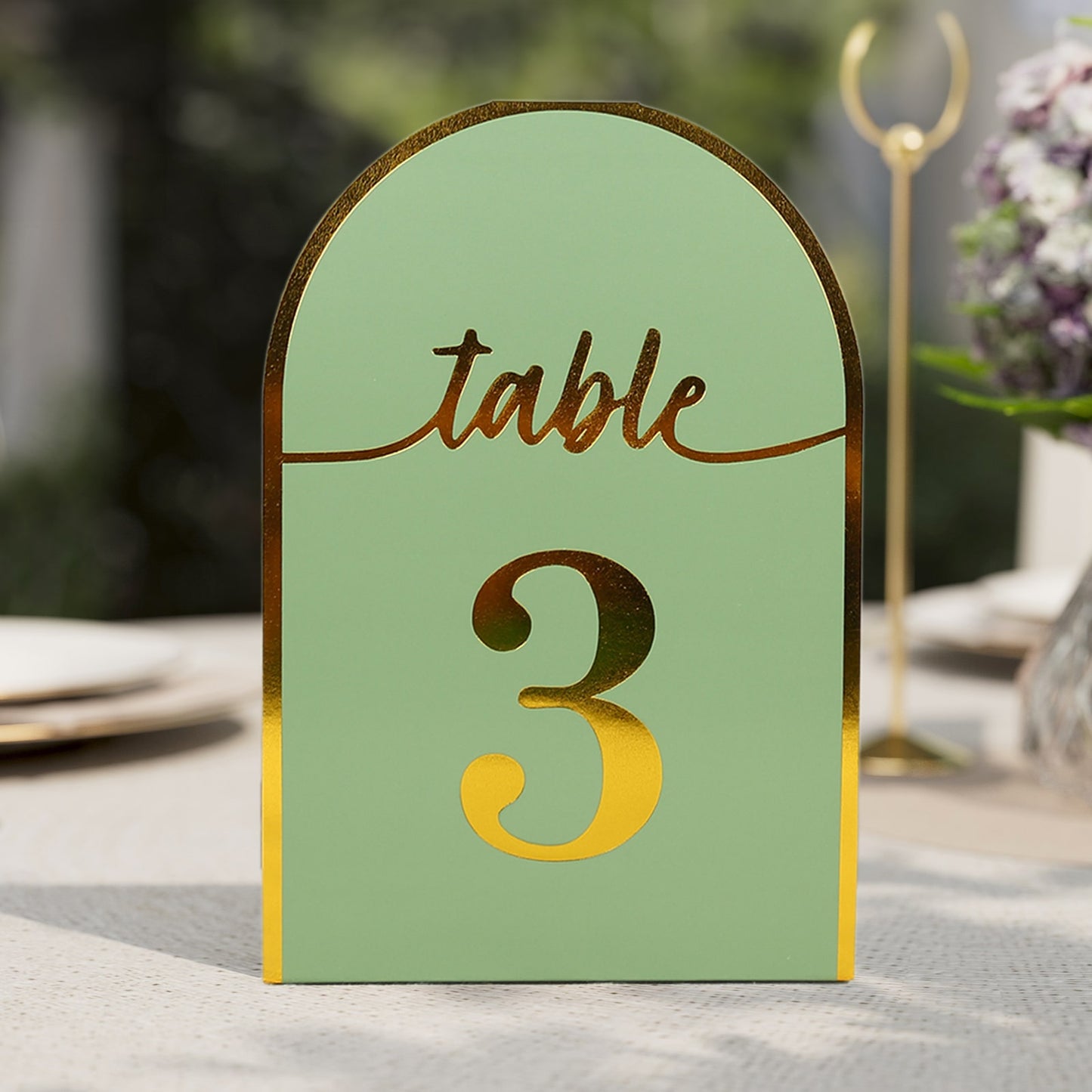 Sage green double-sided table number card with metallic gold foil number 3.