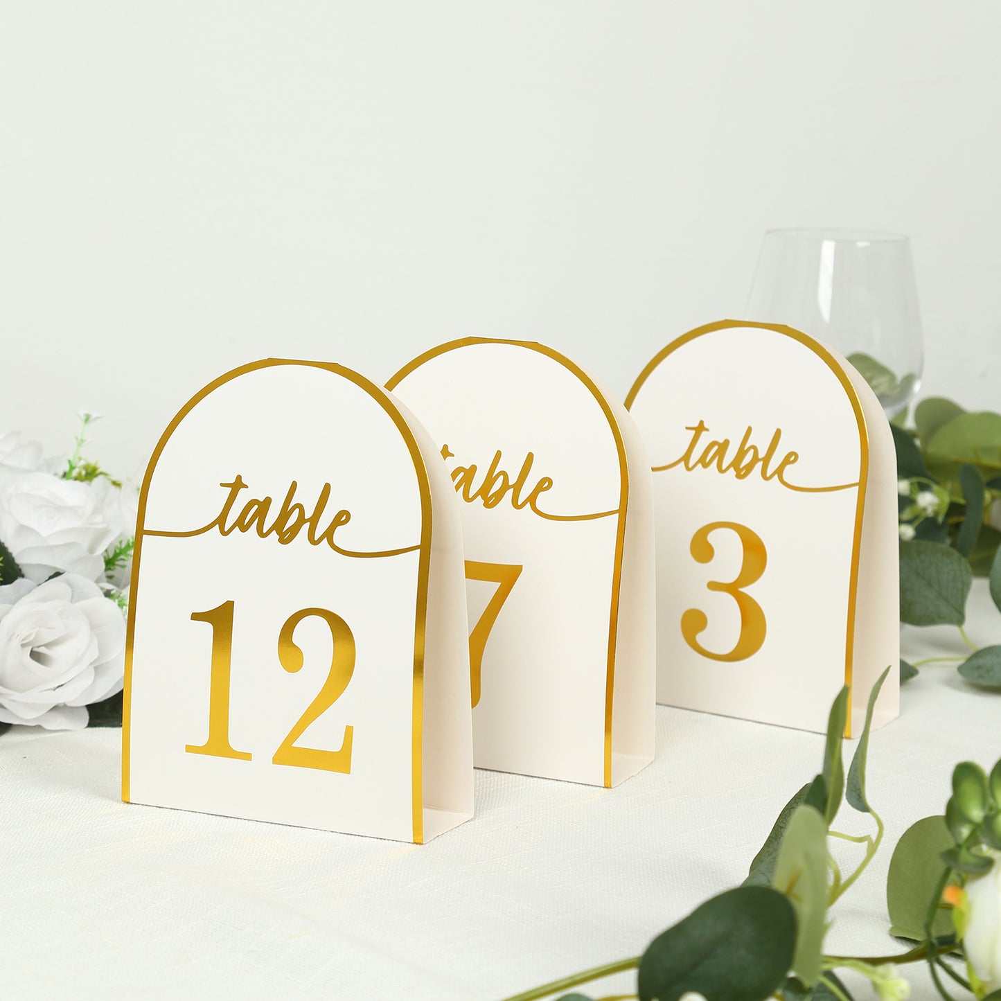 White and gold disposable table numbers, 7" tall, set of 25.