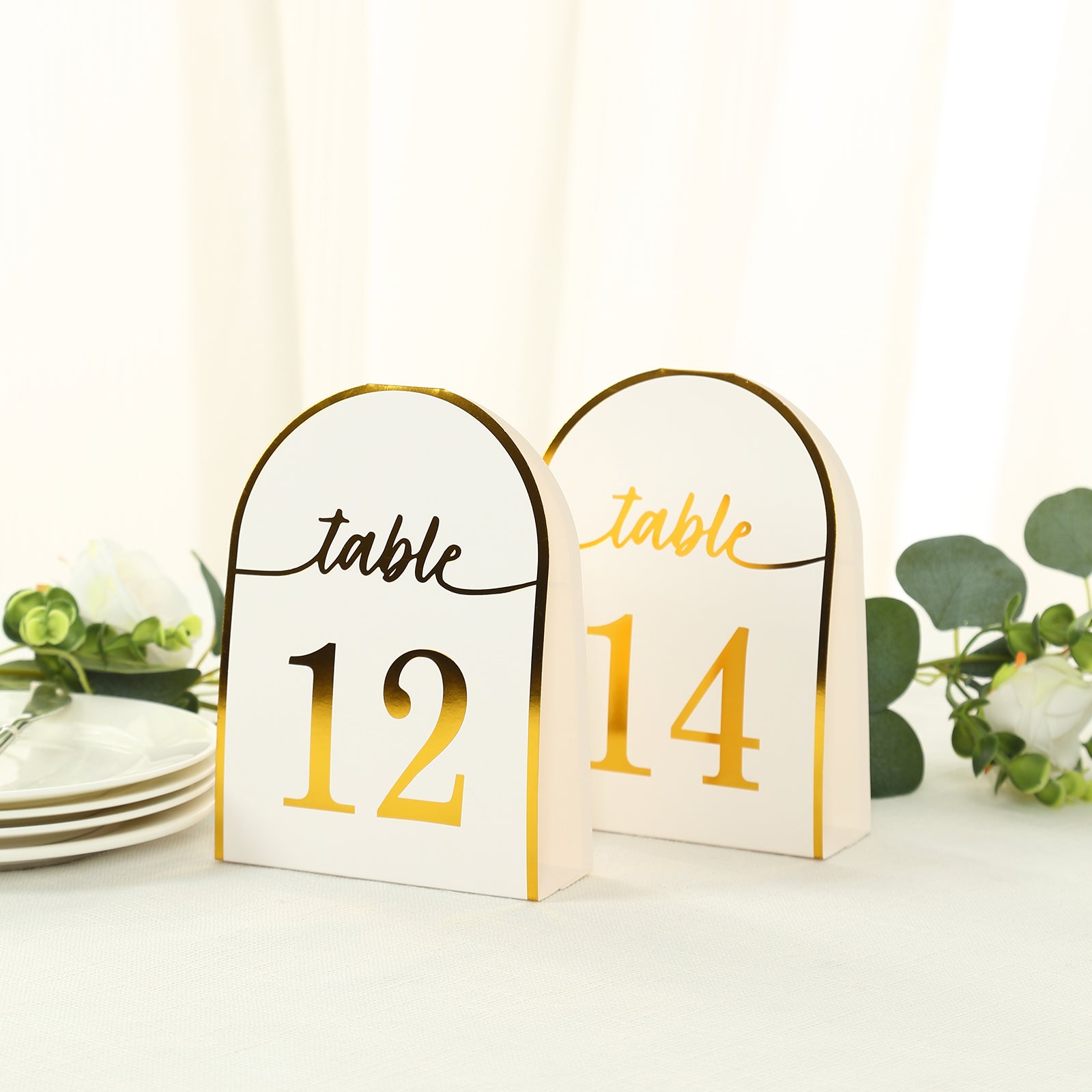 White double-sided table numbers with gold foil, numbers 1-25.