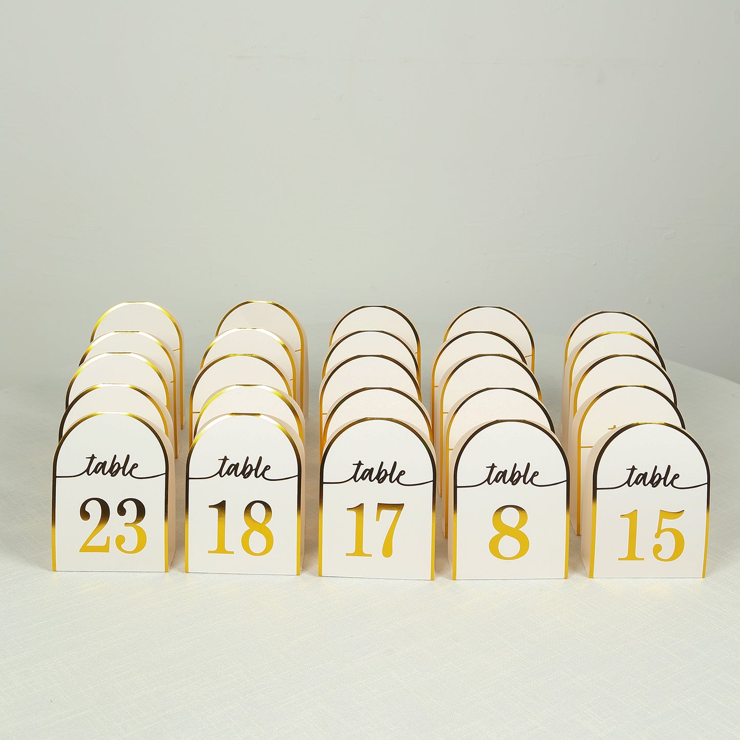 White and gold disposable table numbers, double-sided, numbers 1-25.