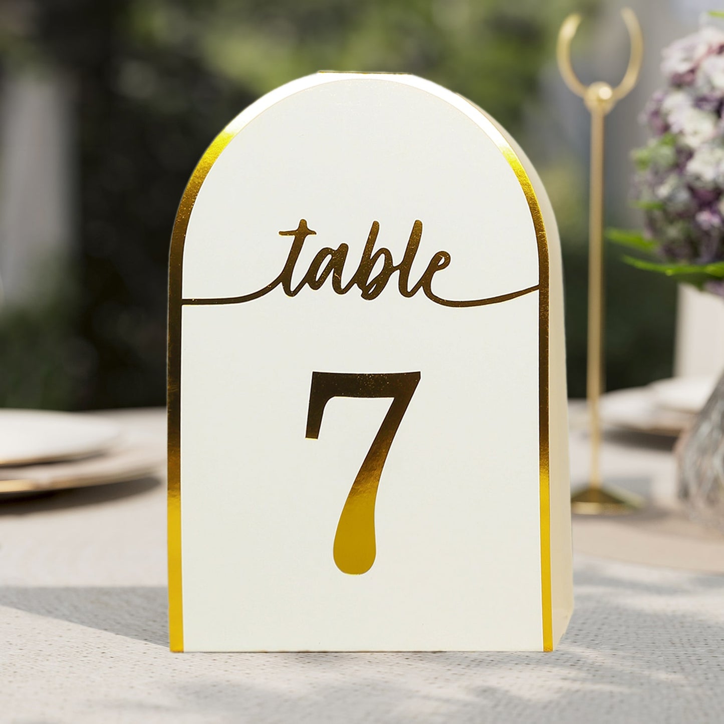 White and metallic gold table number card, free standing, number 7.