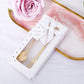 Gold metal spoon and fork bridal shower favor set in a gift box.