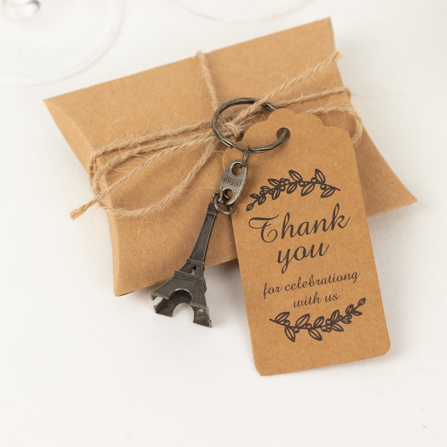 Bronze Eiffel Tower keychain wedding favor with thank you tag.