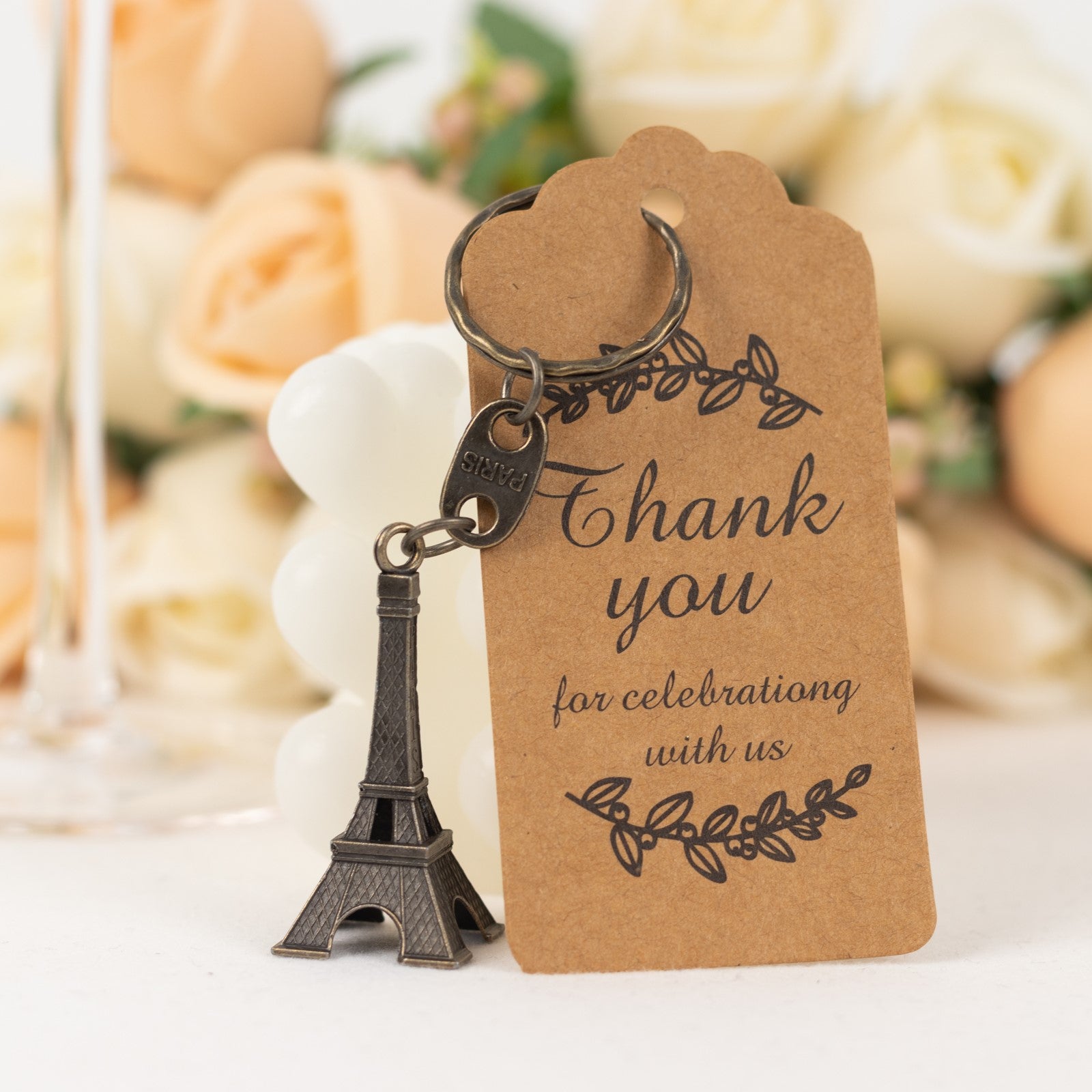 Bronze Eiffel Tower keychain with thank you tag for wedding favors.