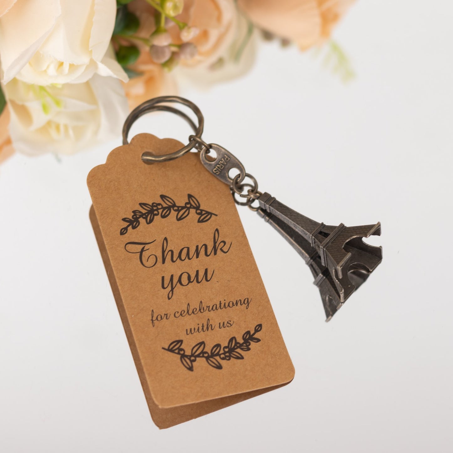 Bronze Eiffel Tower keychain with thank you tag for wedding favors.