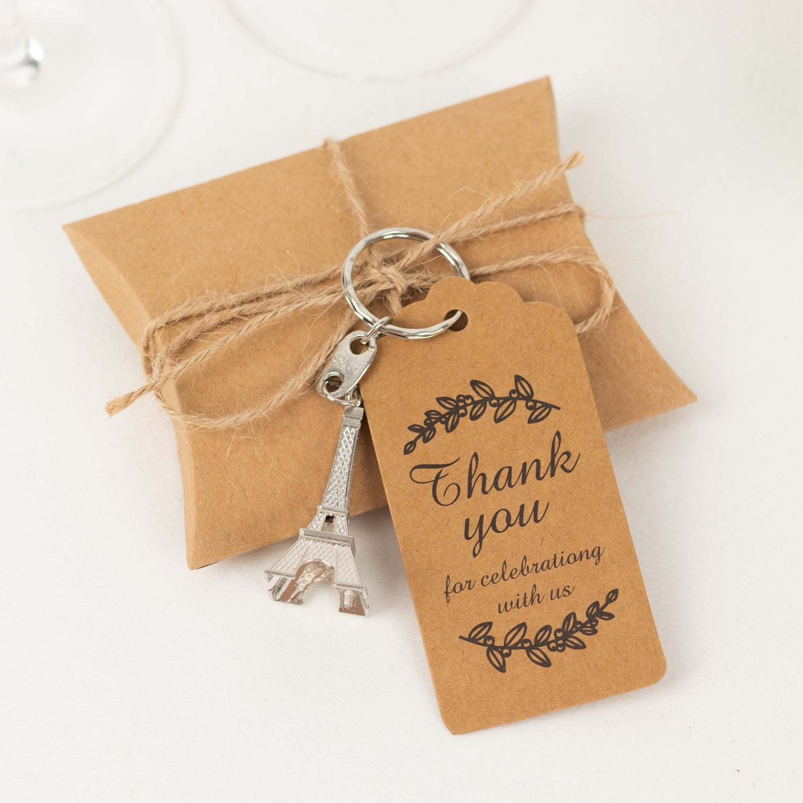 Silver Eiffel Tower keychain wedding favor with thank you tag.