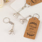 Silver Eiffel Tower keychain wedding favors with thank you tag.