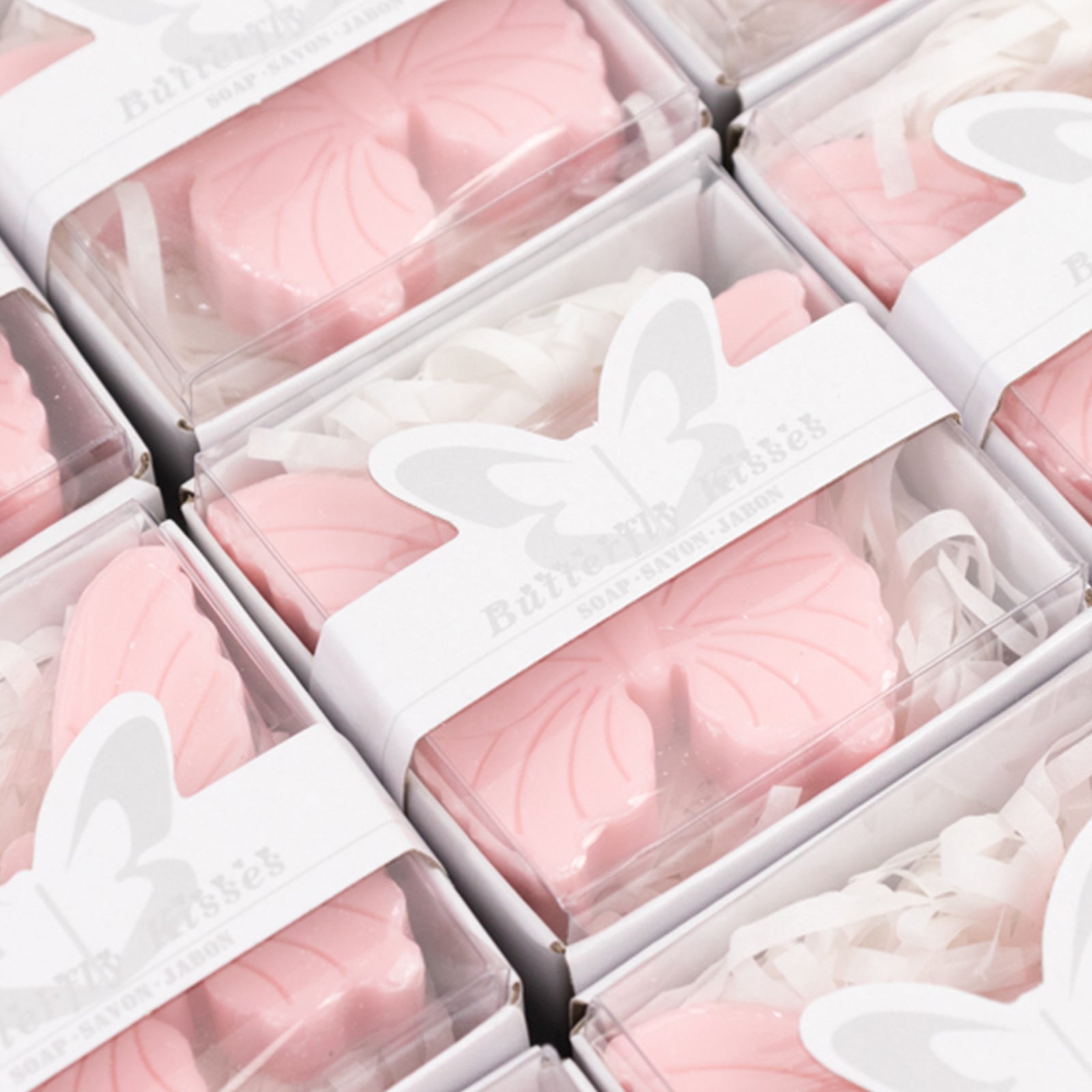 Blush butterfly soap favors in gift boxes for baby showers.