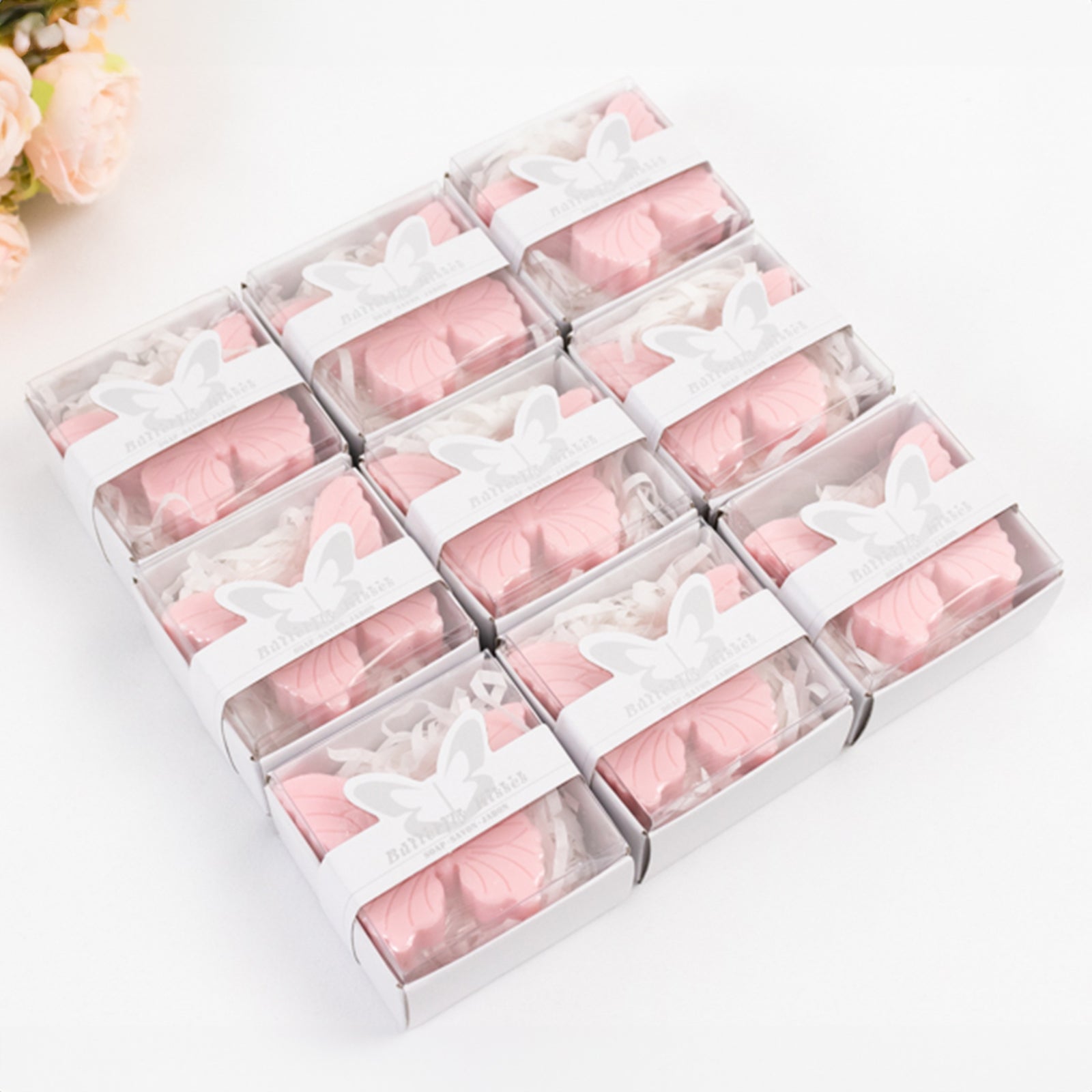Blush butterfly soap favors in gift boxes for baby or bridal showers.