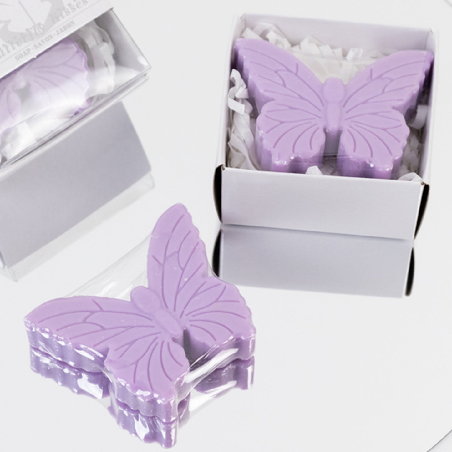 Lavender butterfly soap favors in gift boxes for baby or bridal showers.