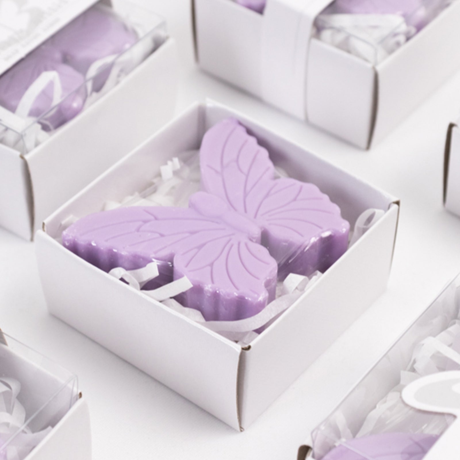 Lavender butterfly soap favors in gift boxes for baby or bridal showers.
