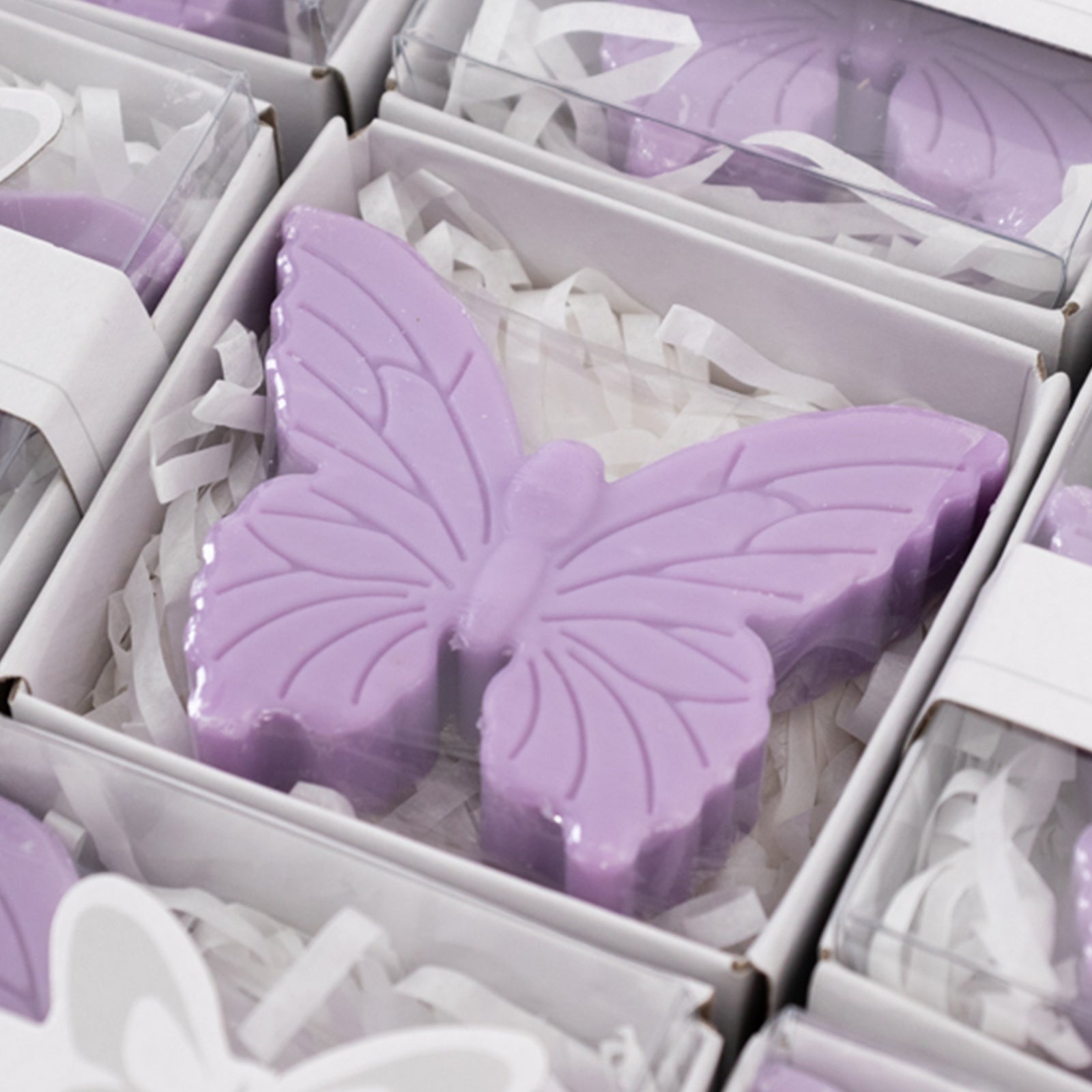Lavender butterfly soap favors in gift boxes, perfect for baby showers.
