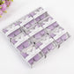 Lavender butterfly soap favors in gift boxes for baby shower or wedding.