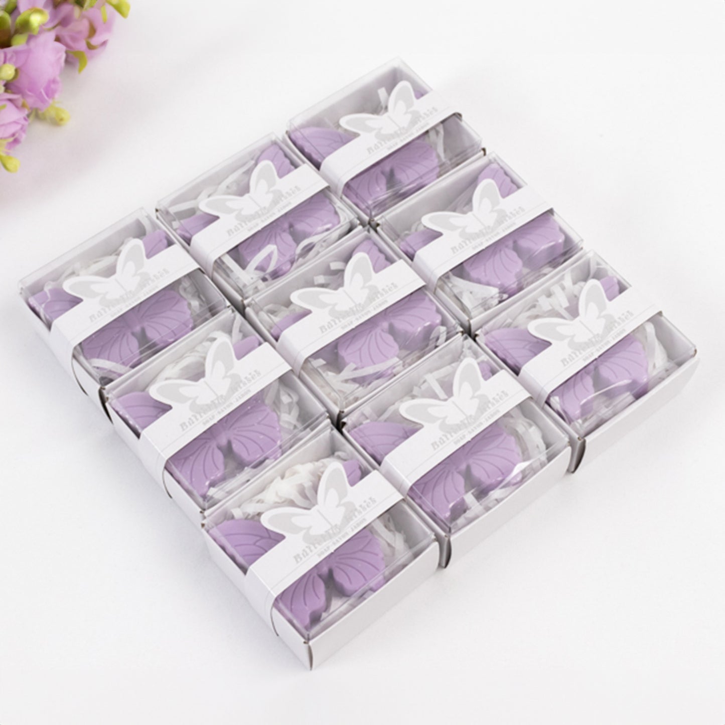 Lavender butterfly soap favors in gift boxes for baby shower or wedding.