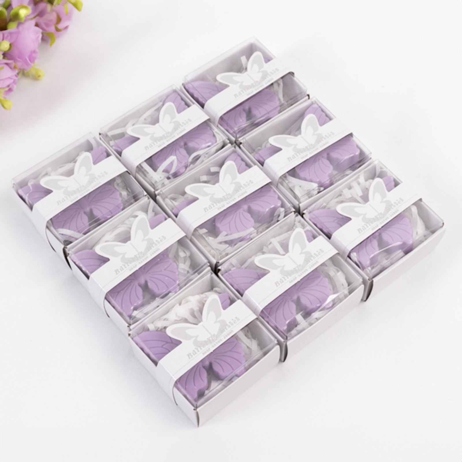 Lavender butterfly soap favors in gift boxes for baby shower or wedding.