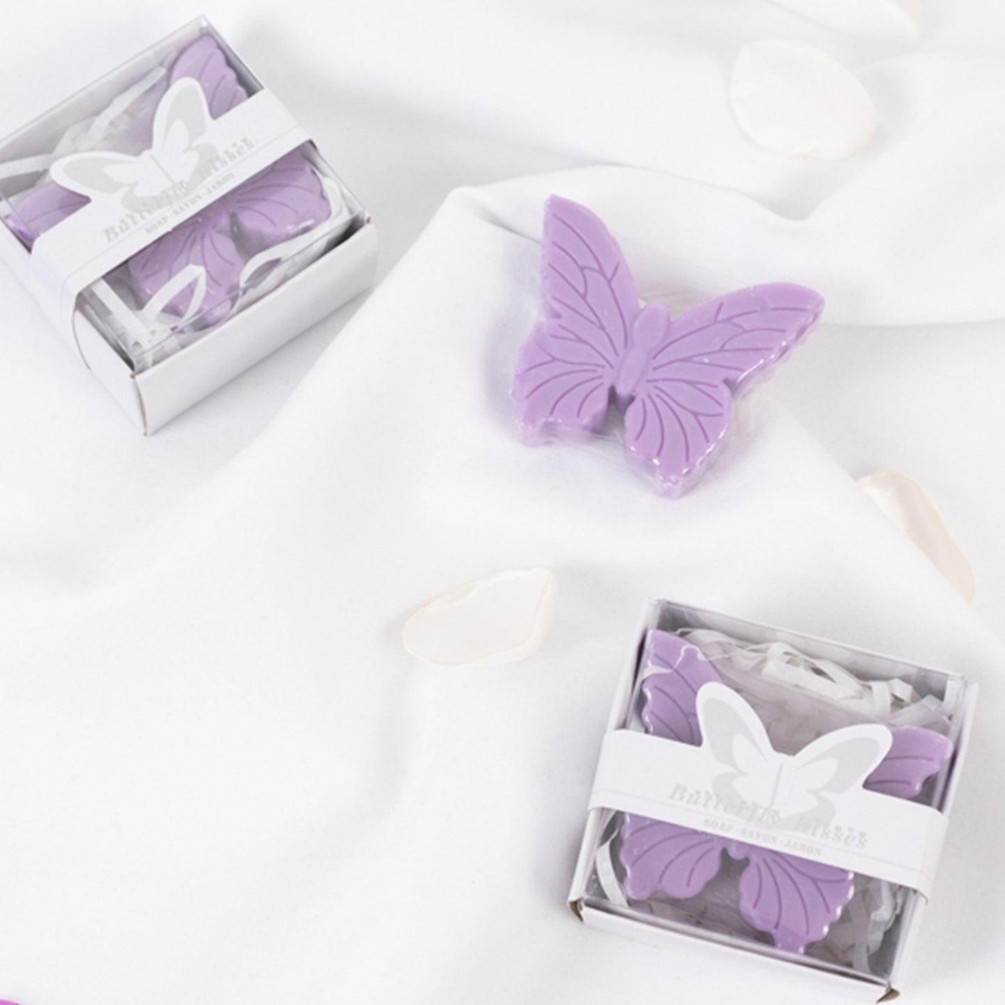 Lavender butterfly soap favors in gift boxes for baby shower.