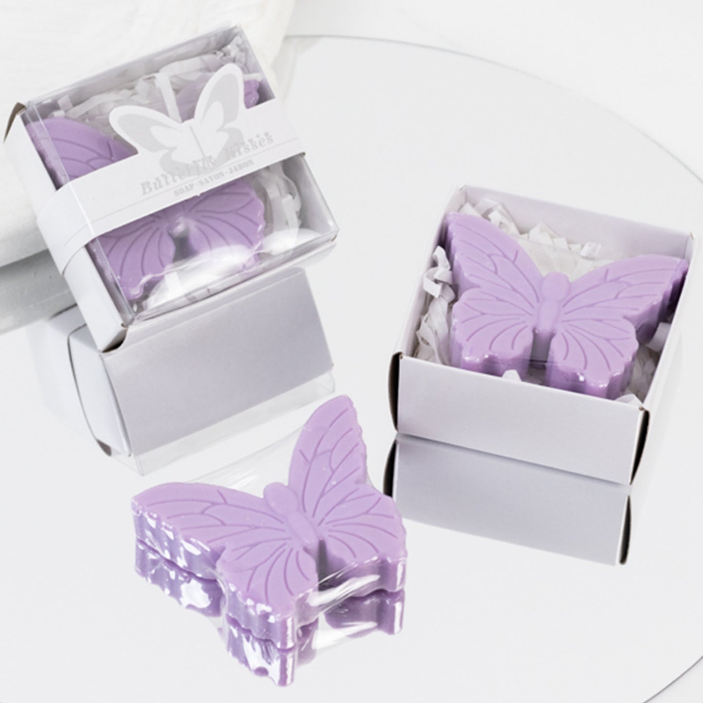 Lavender butterfly soap favors in gift boxes for baby showers and weddings.
