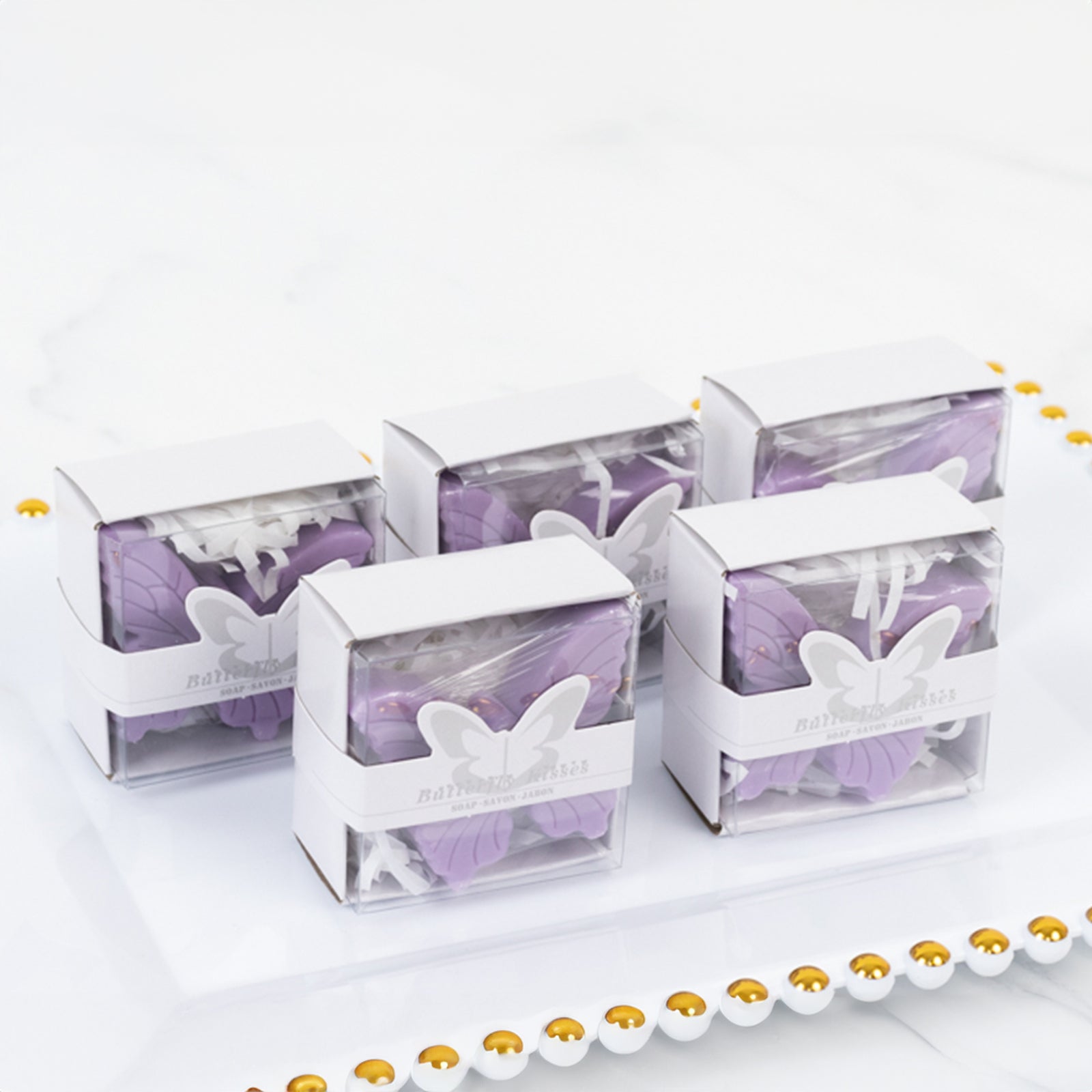 Lavender butterfly soap favors in gift boxes for baby shower or wedding.