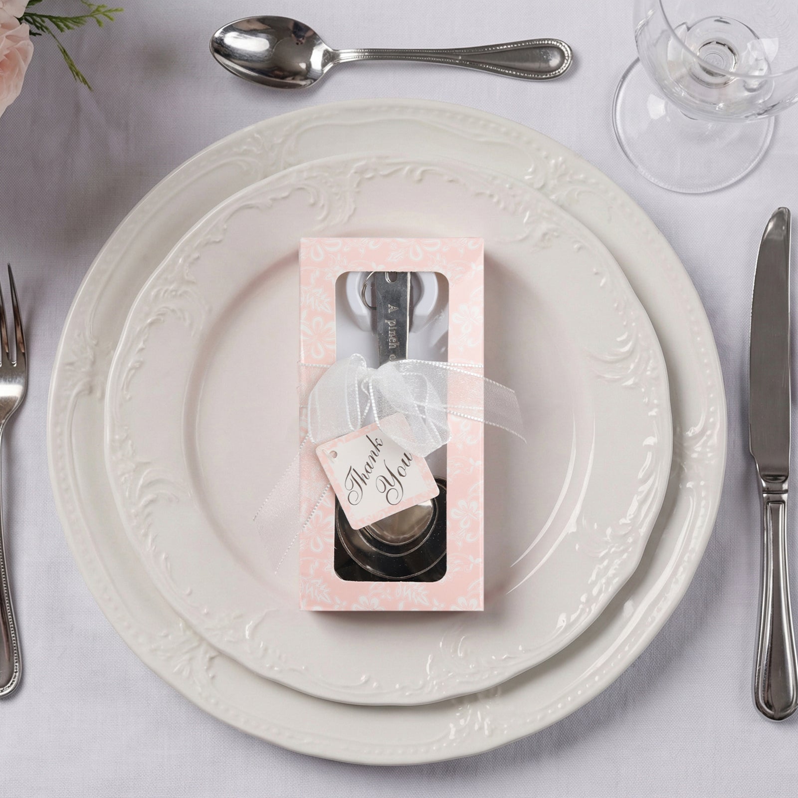 Engraved silver heart measuring spoon set wedding favors in gift box.
