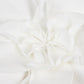 White soft foam craft daisy flower heads in a 4 pack.