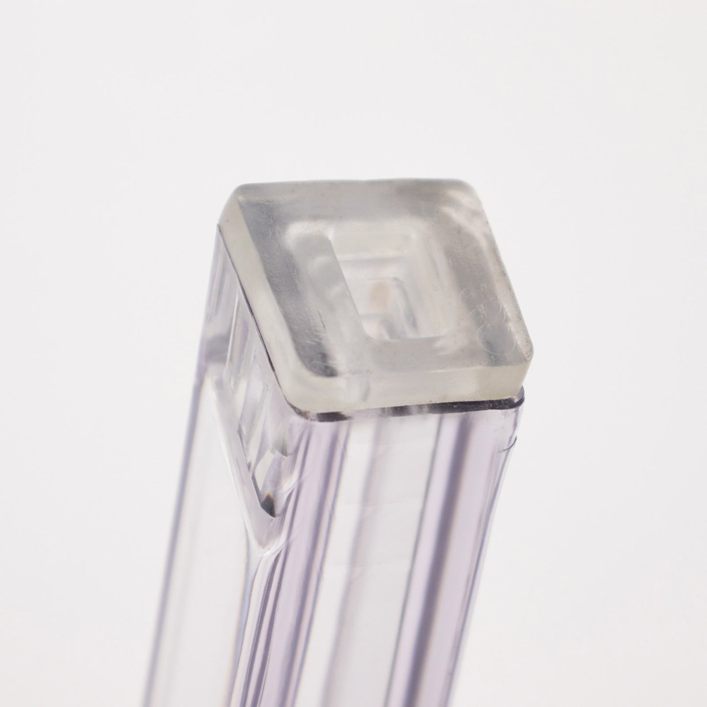 Clear acrylic ghost banquet chair with oval back, fully assembled and armless.