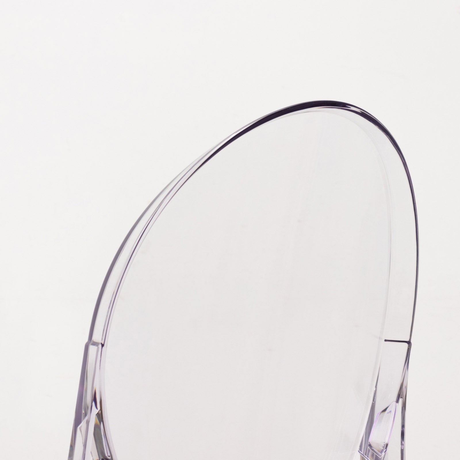 Clear acrylic ghost banquet chair with oval back, fully assembled and armless.