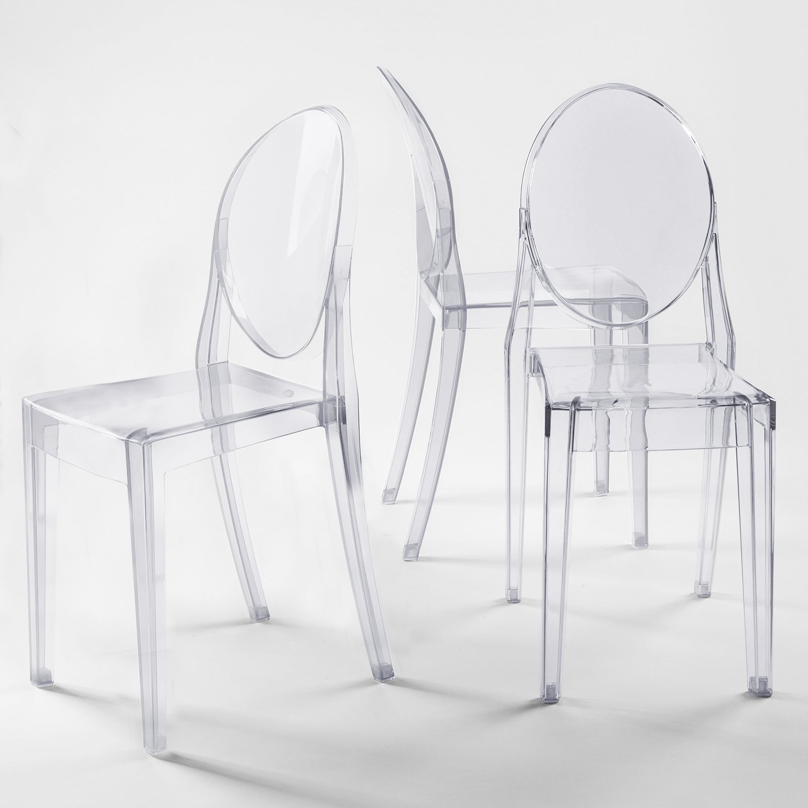 Clear acrylic ghost banquet chairs with oval back, fully assembled and armless.