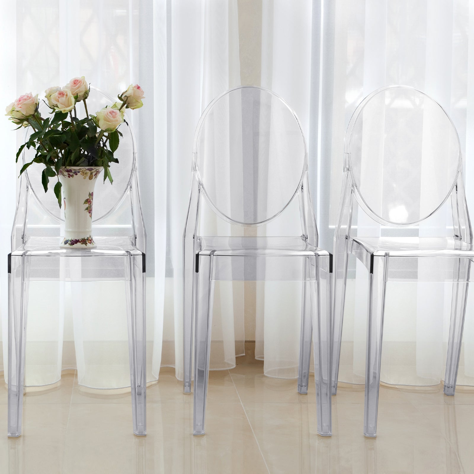 Clear acrylic ghost banquet chairs with oval backs, fully assembled and armless.