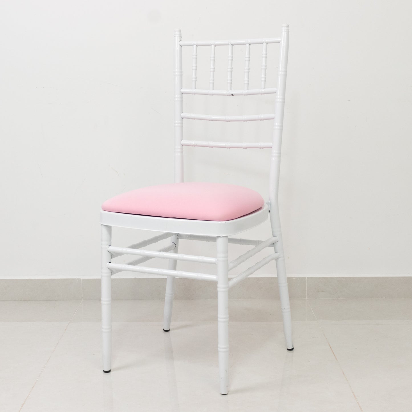 Pink spandex seat pad slipcover for Chiavari chair.