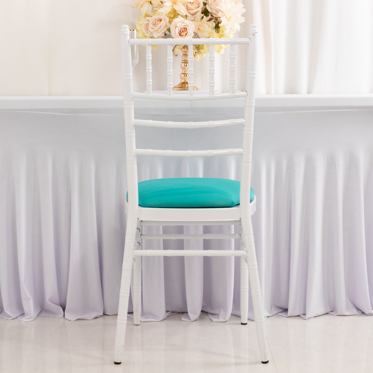 Turquoise spandex seat pad slipcover for Chiavari chair.