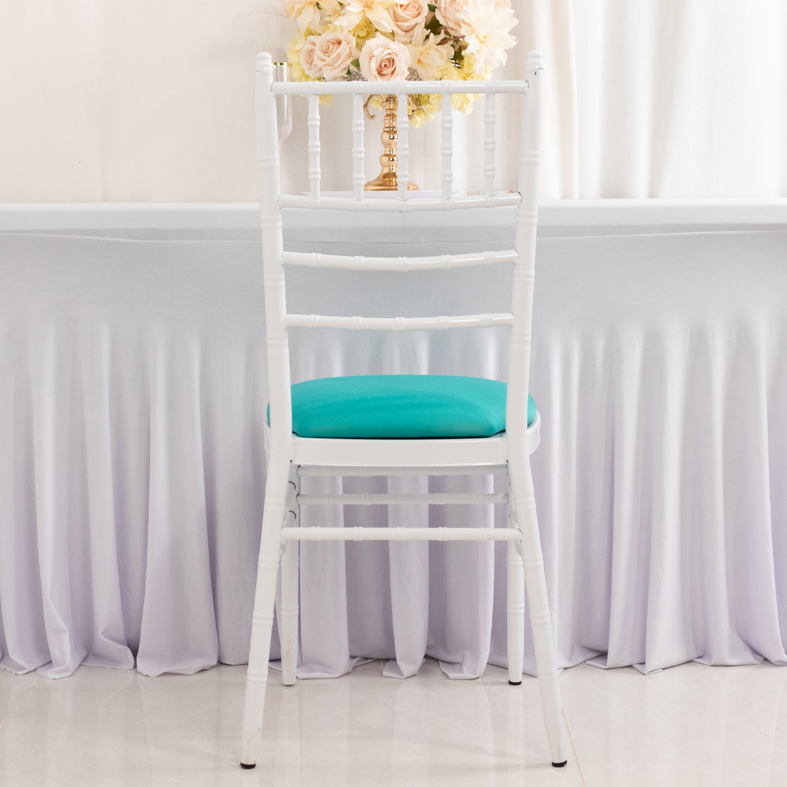 Turquoise spandex seat pad slipcover for Chiavari chair.