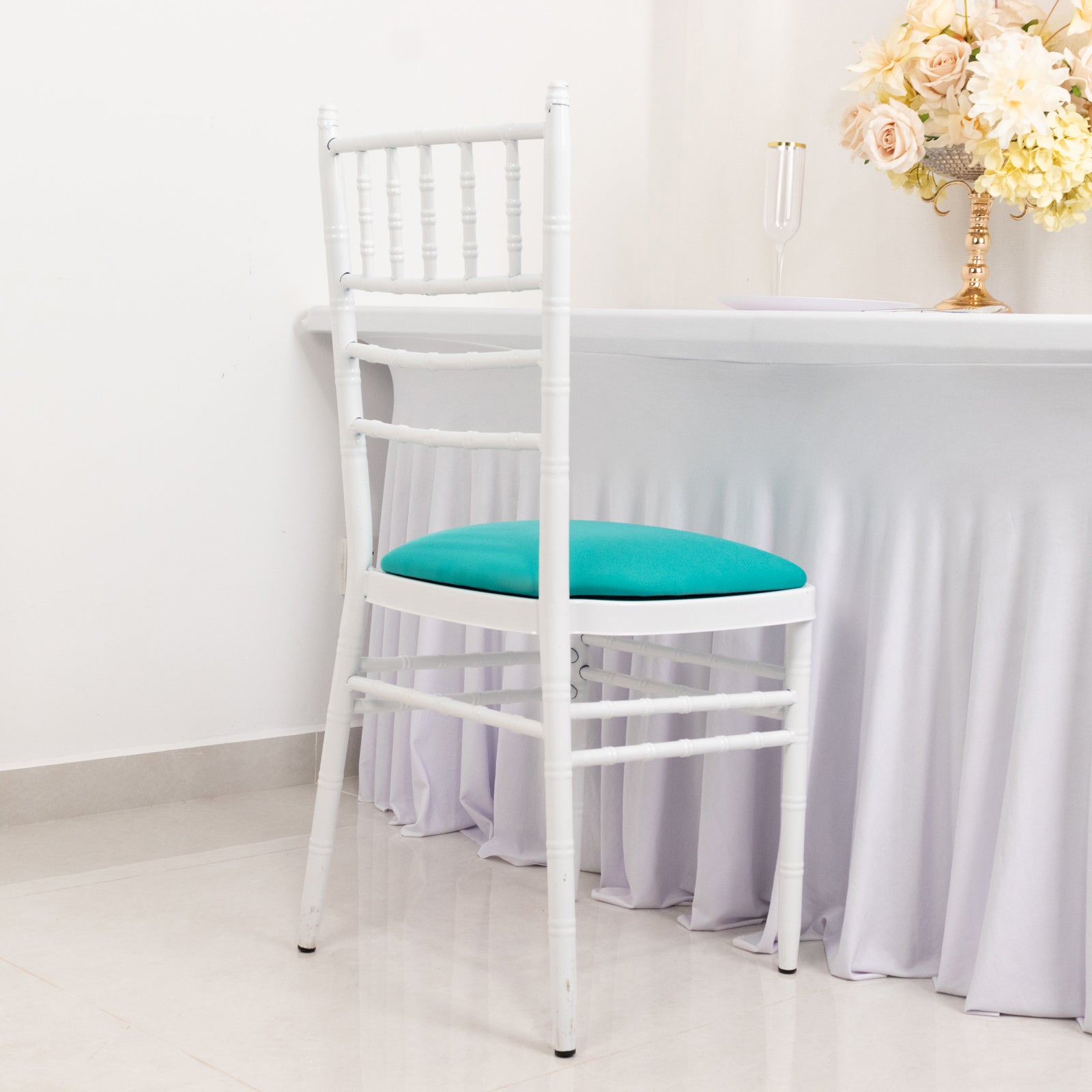 Turquoise spandex seat pad slipcover for Chiavari chair.