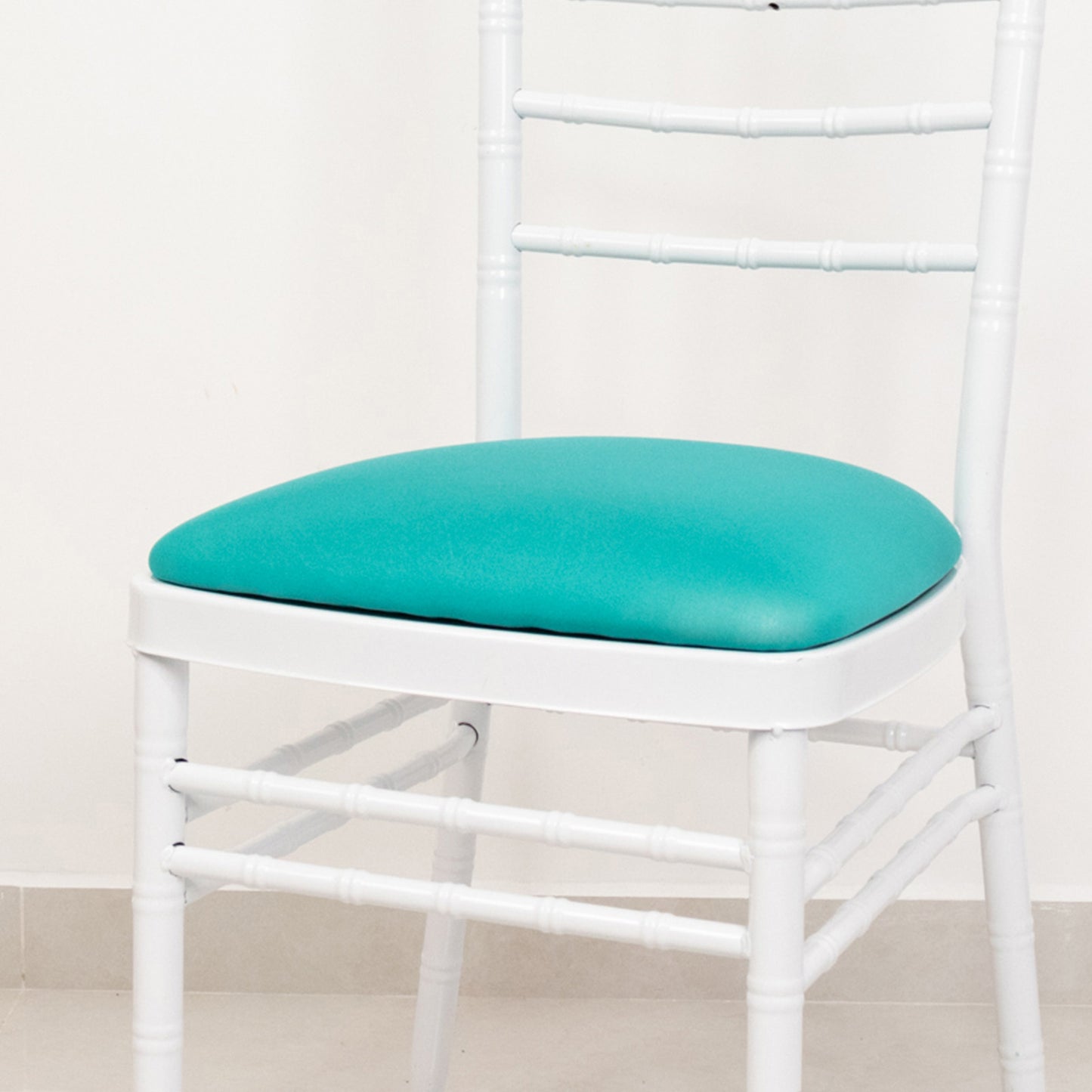 Turquoise spandex seat pad slipcover for Chiavari chair.