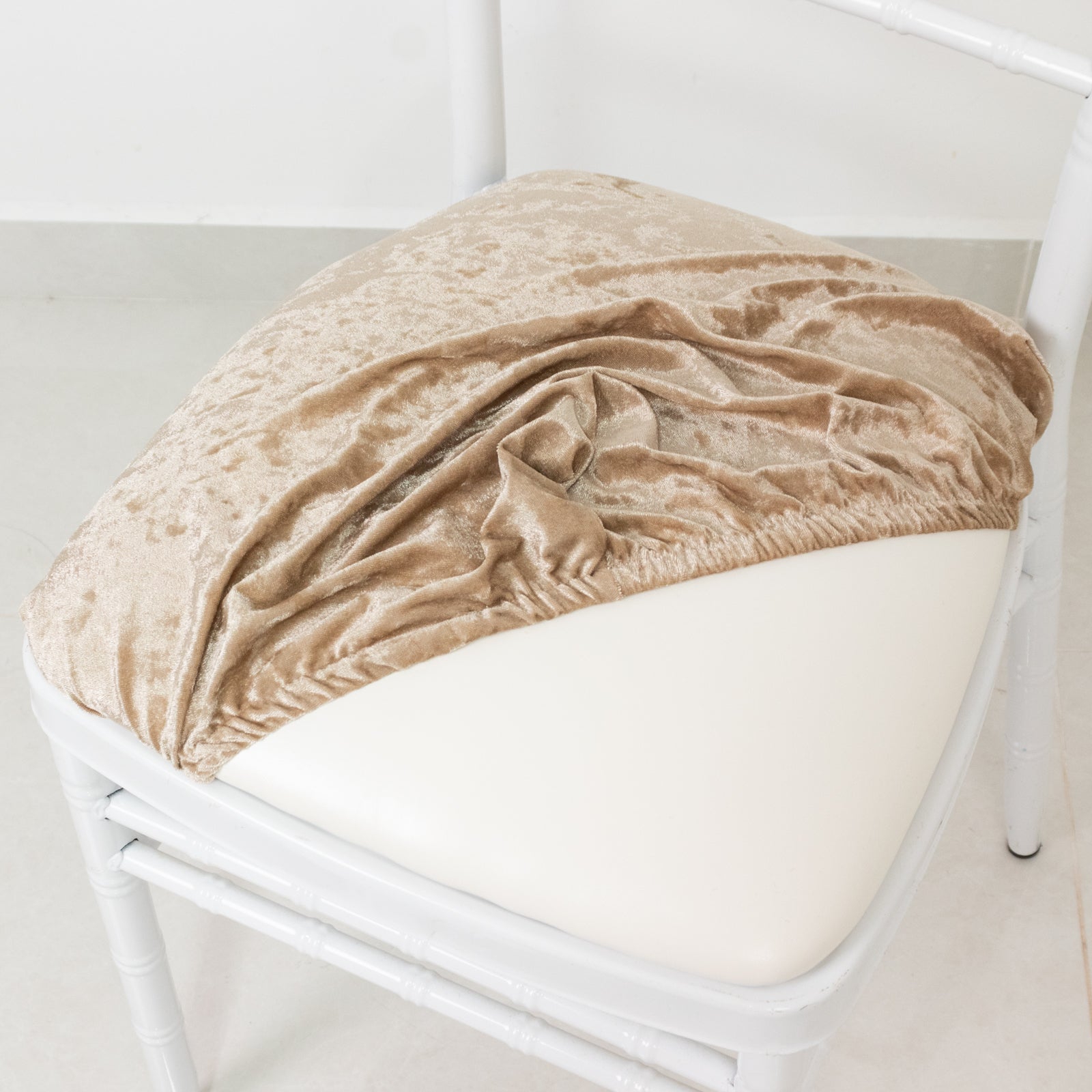 Beige crushed velvet seat pad cover for Chiavari chair.