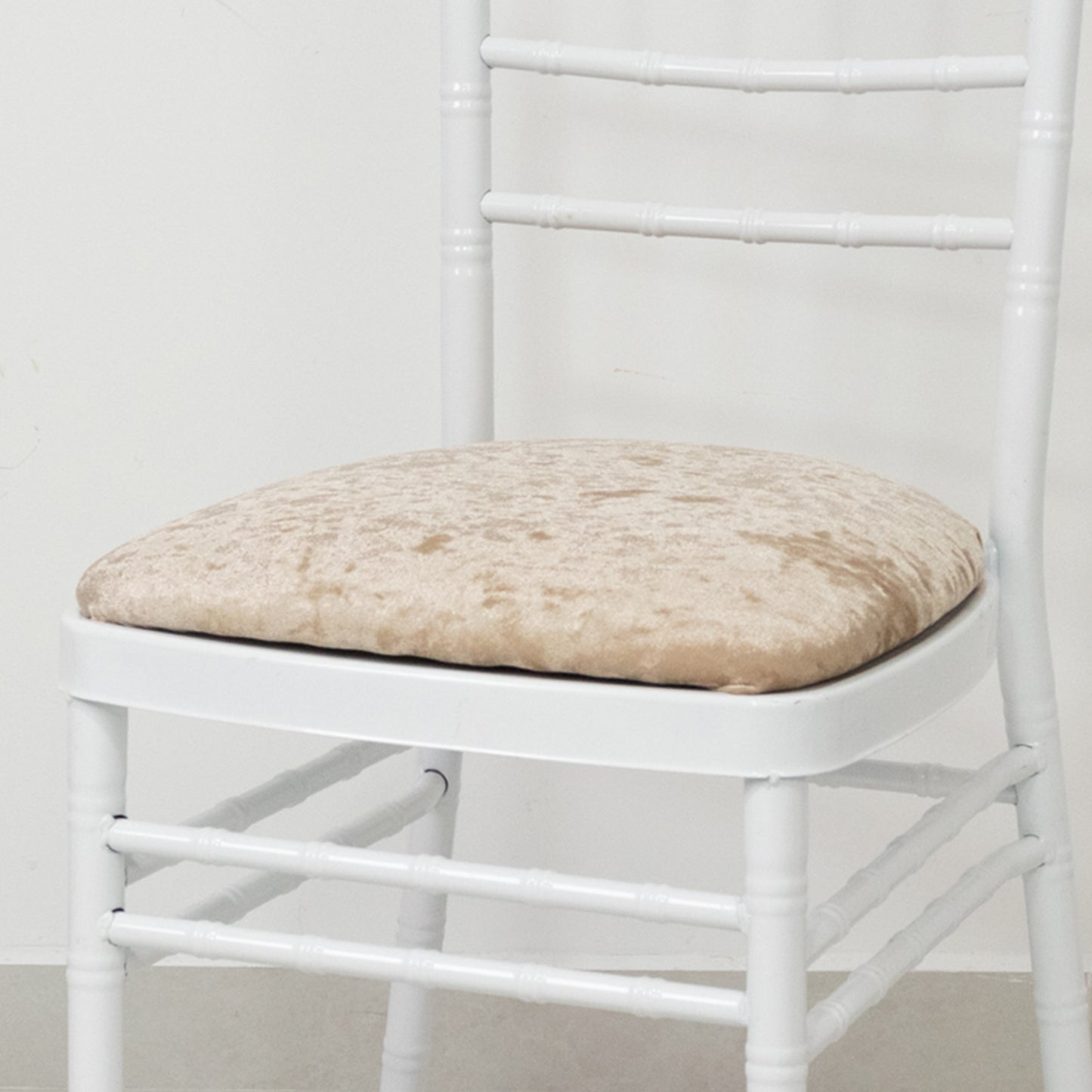 Beige crushed velvet seat pad cover for Chiavari chair.