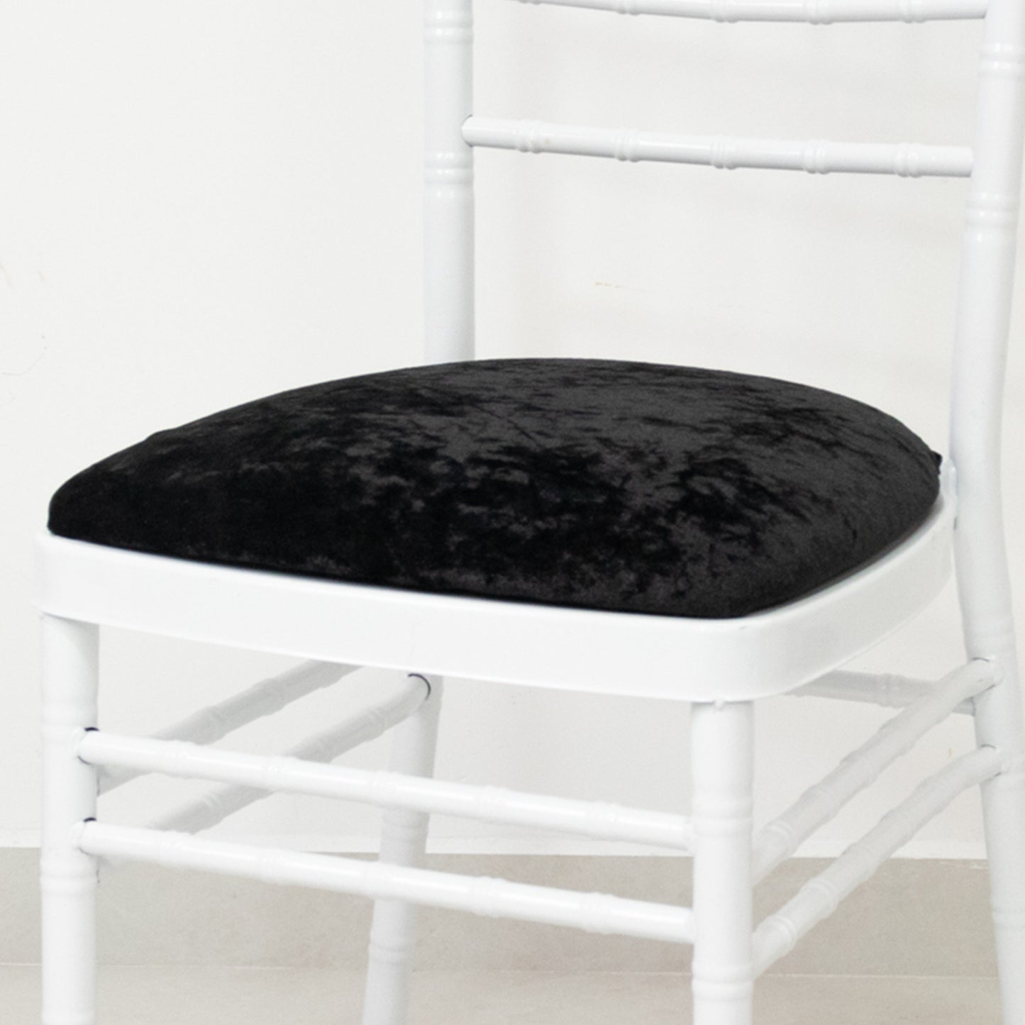 Black crushed velvet seat pad cover for Chiavari chair.