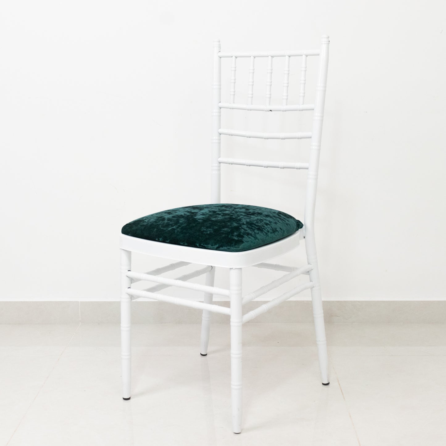 Hunter Emerald Green Chiavari chair cushion cover on a white chair.
