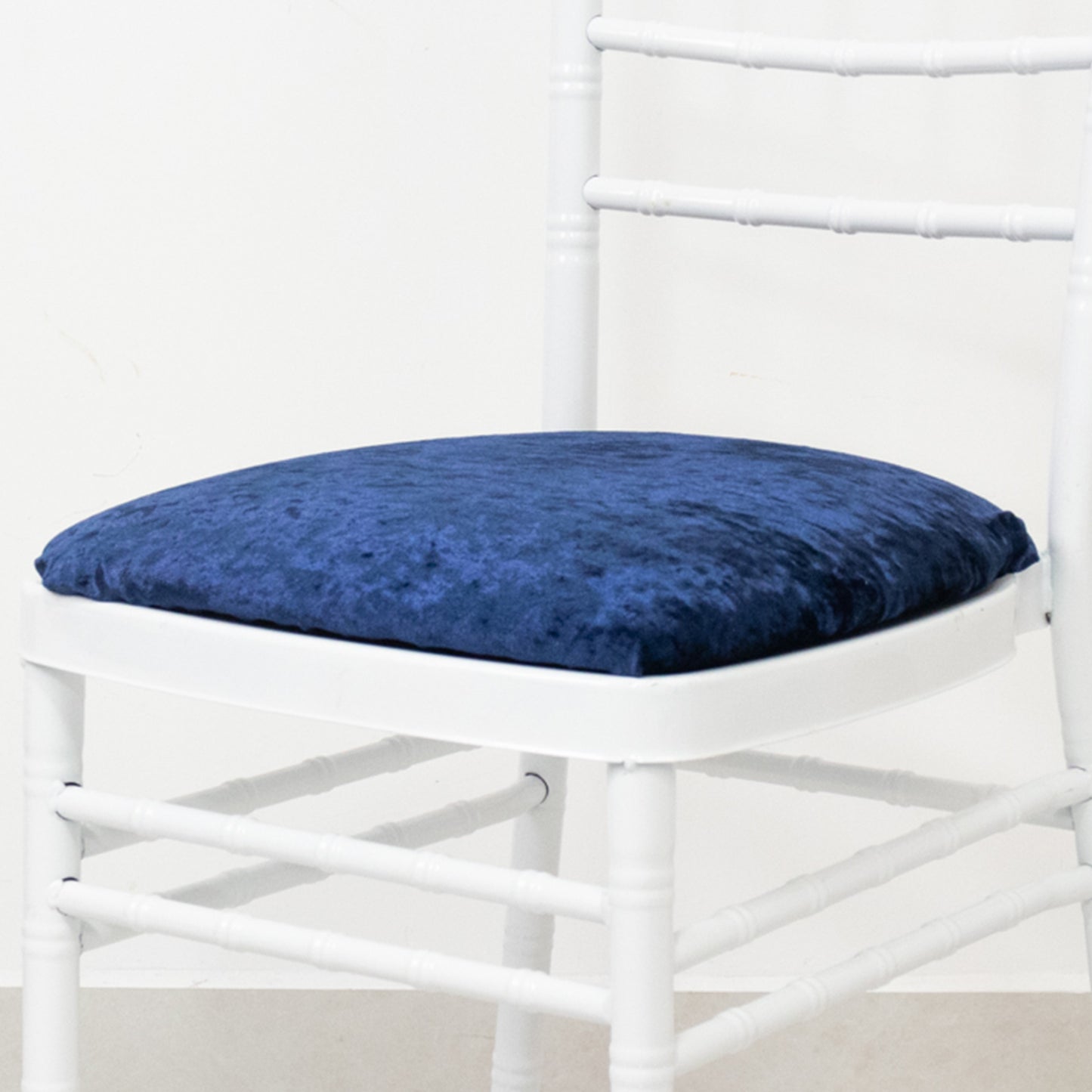 Navy blue crushed velvet seat pad cover for Chiavari chair.
