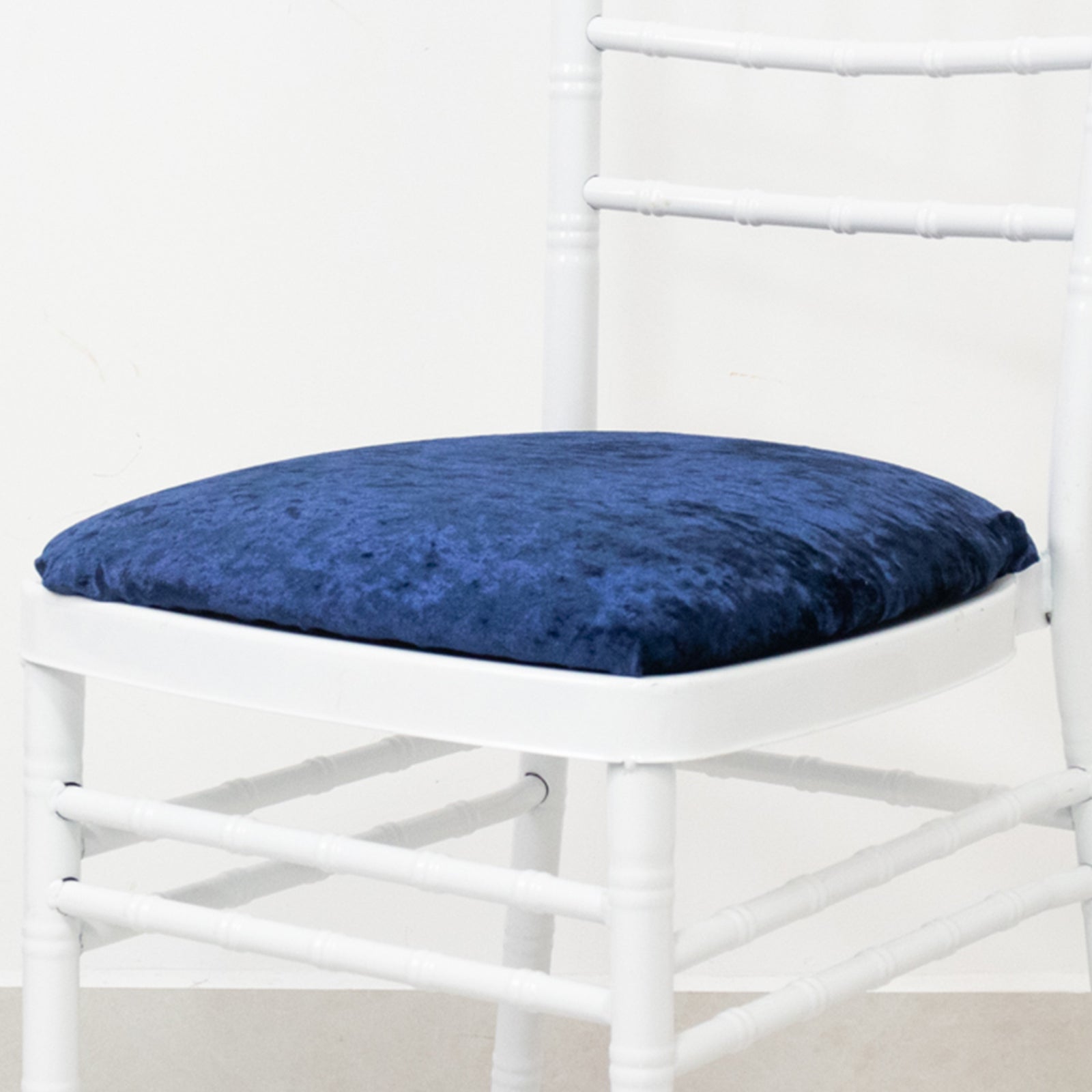 Navy blue crushed velvet seat pad cover for Chiavari chair.