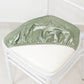 Sage green crushed velvet seat pad cover for Chiavari chair.