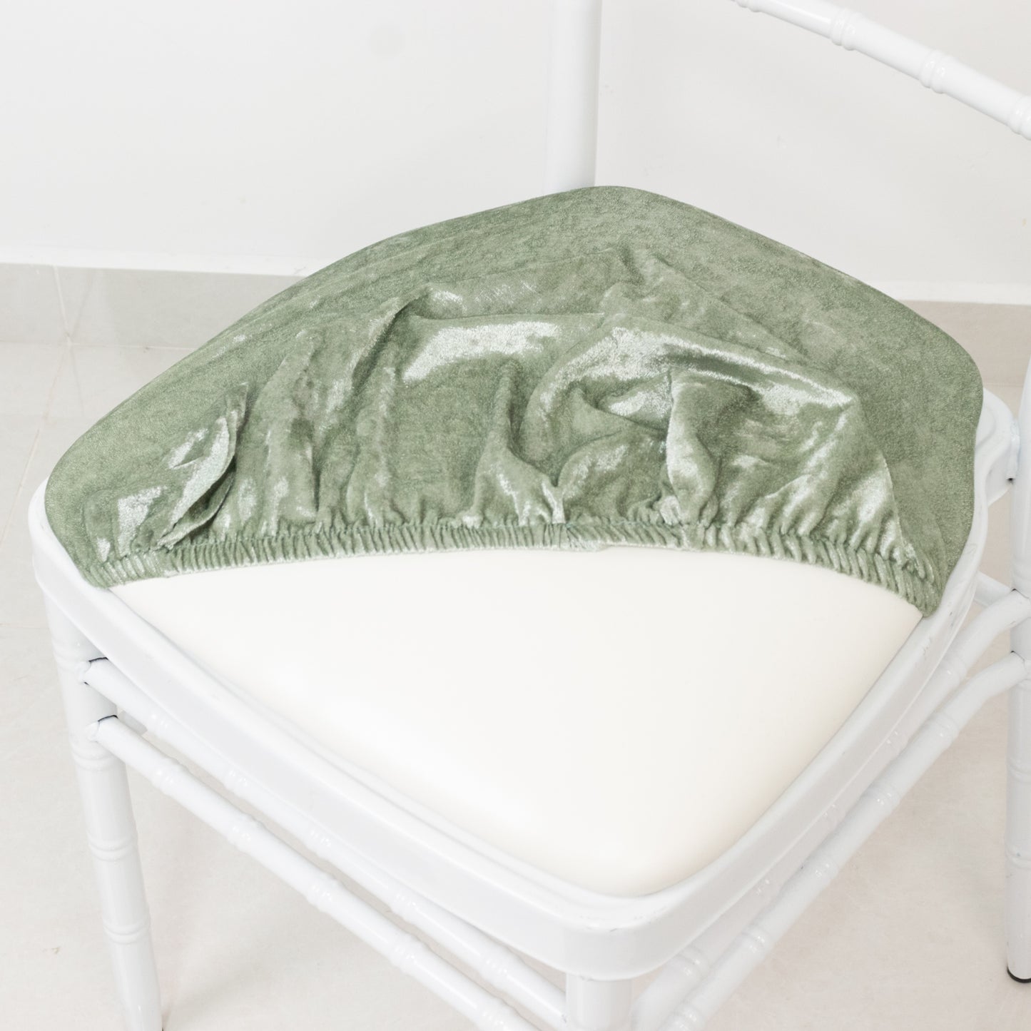 Sage green crushed velvet seat pad cover for Chiavari chair.