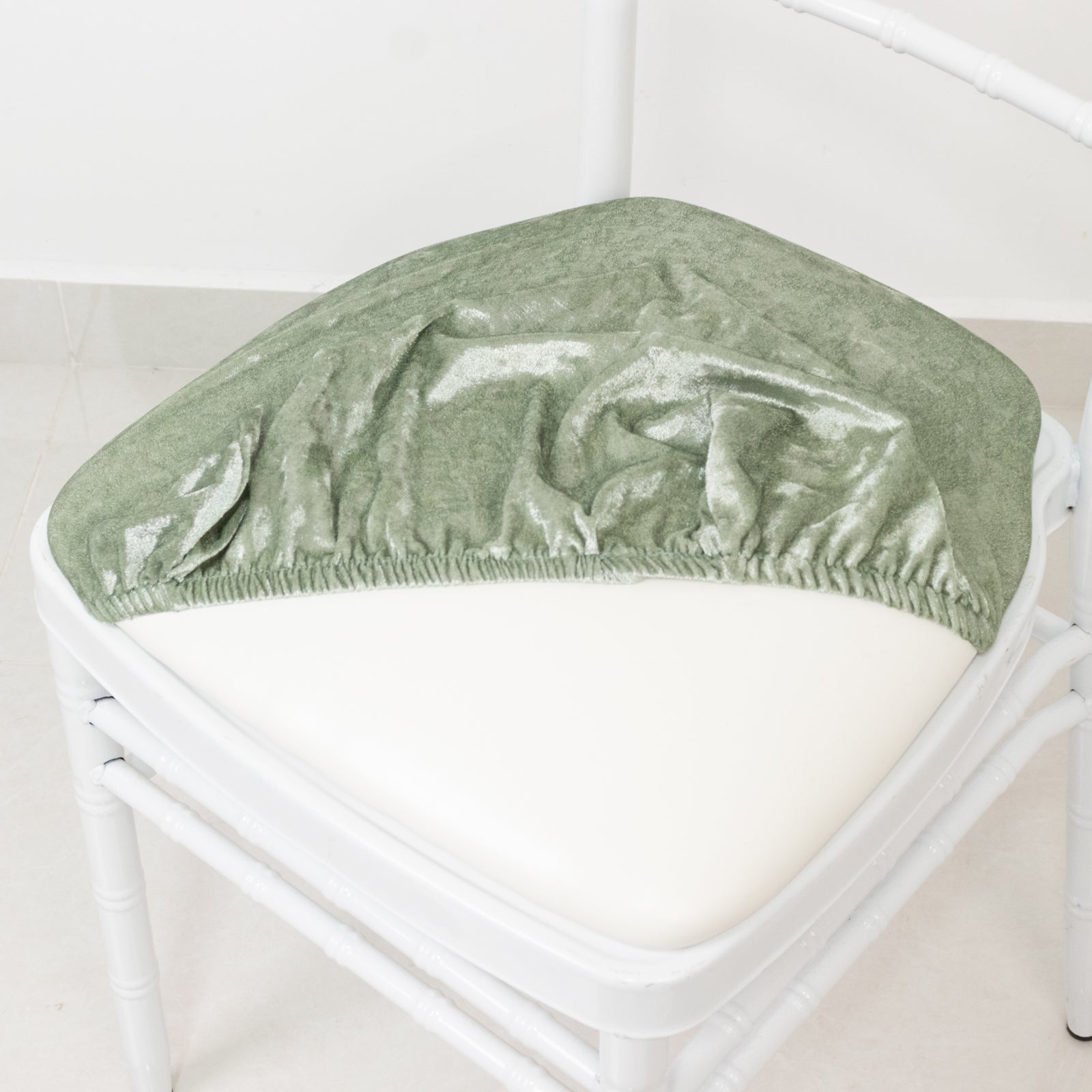 Sage green crushed velvet seat pad cover for Chiavari chair.